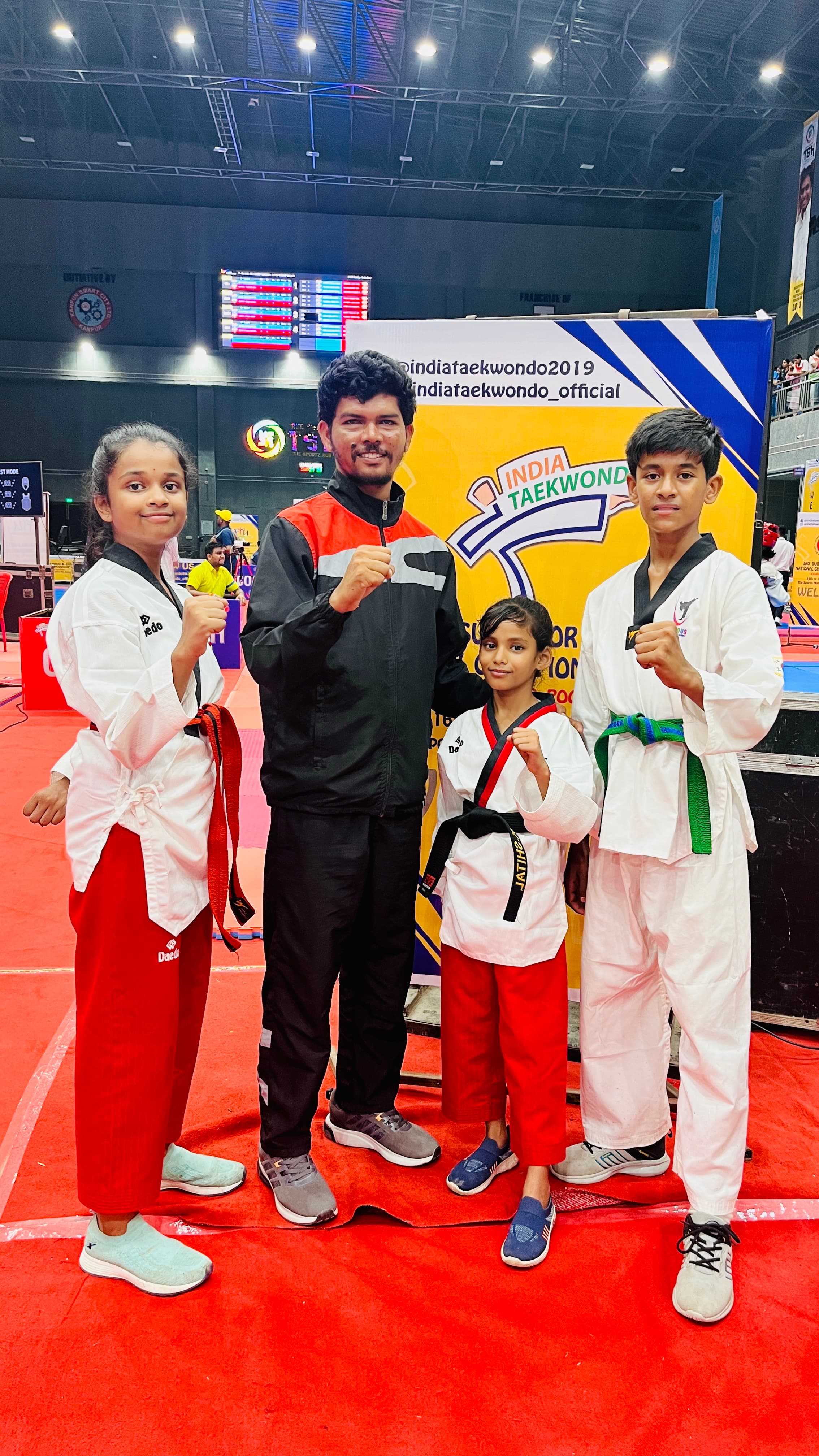 Students and coach at an India Taekwondo national event