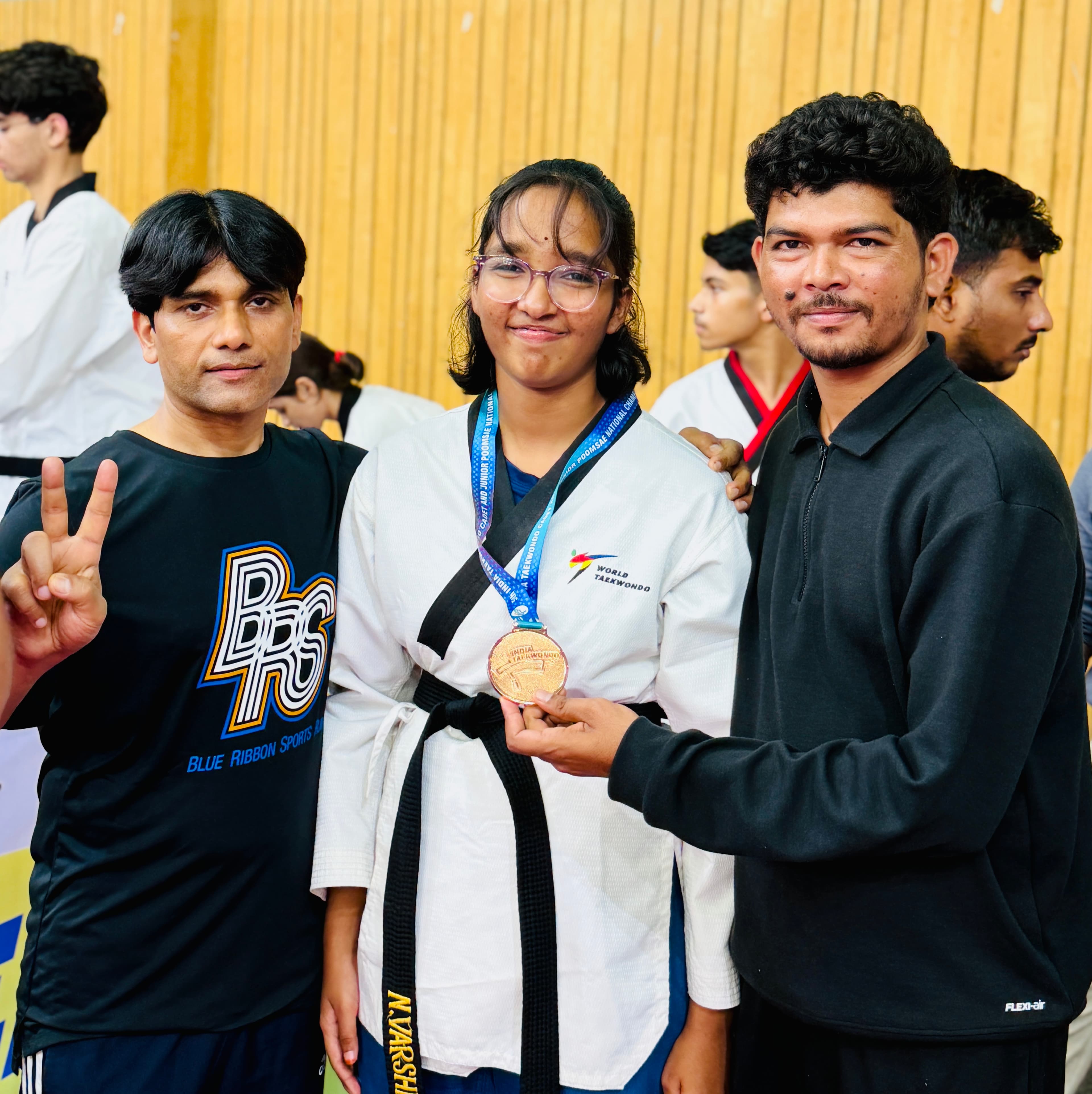Student receiving a medal at the India Taekwondo Poomsae Championship